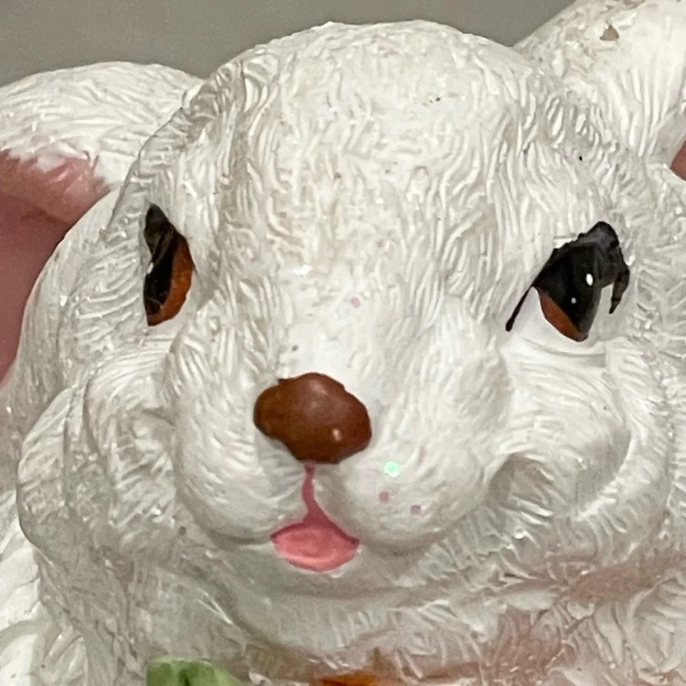 Cute rabbit with carrots statute - rabbit sparkles in light (see video)